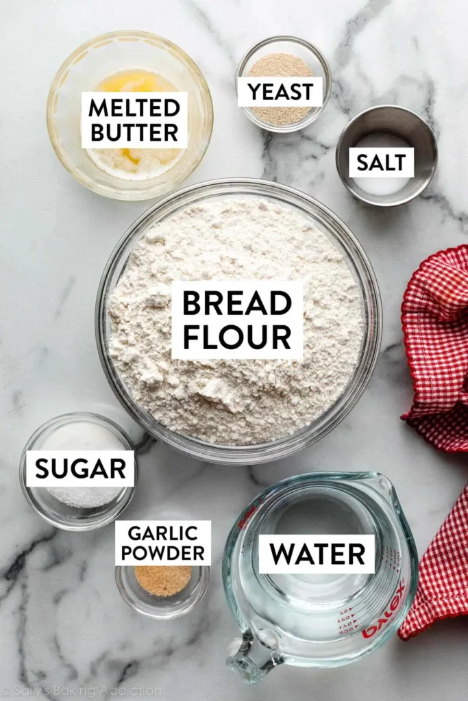 bread flour water butter ingredients on counter